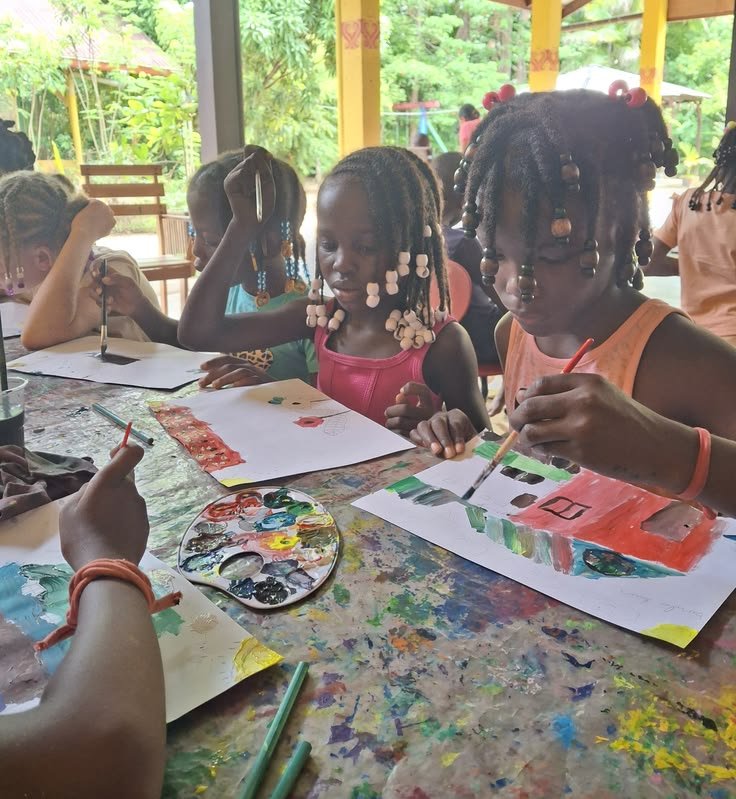 Children painting at a creative workshop